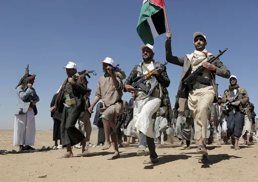 Houthi rebel fighters march during a rally of support for the Palestinians in the Gaza Strip and against the U.S. strikes on Yemen outside Sanaa on Jan. 22, 2024. (AP Photo, File)