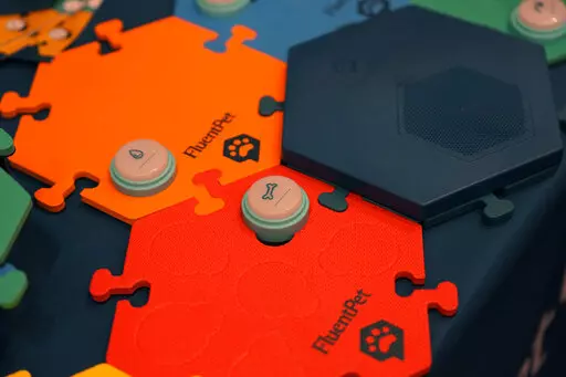 FluentPet dog communication buttons are on display during the Pepcom Digital Experience before the start of the CES tech show, Wednesday, Jan. 4, 2023, in Las Vegas. (AP Photo/John Locher)