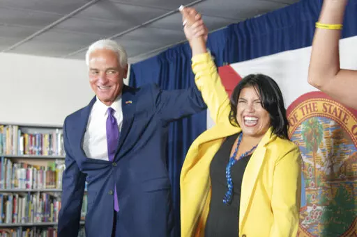 U.S. Rep. Charlie Crist celebrates as he announces his running mate Karla Hernández-Mats at Hialeah Middle School in Hialeah, Fla., Saturday Aug. 27, 2022 as he challenges Republican Gov. Ron DeSantis in November (AP Photo/Gaston De Cardenas)