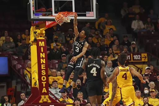 Mississippi State guard Shakeel Moore (3) makes a basket against Minnesota during the first half of an NCAA college basketball game Sunday, Dec. 11, 2022, in Minneapolis. (AP Photo/Stacy Bengs)