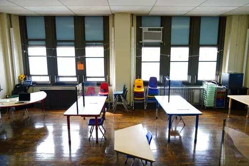 Desks are spaced apart ahead of planned in-person learning at an elementary school on March 19, 2021, in Philadelphia. The COVID-19 pandemic spared no state or region as it caused historic learning setbacks for America’s children, erasing decades of academic progress and widening racial disparities, according to results of a national test that provide the sharpest look yet at the scale of the crisis. (AP Photo/Matt Rourke, File)