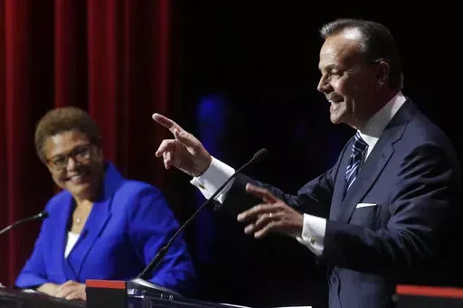 U.S. Rep. Karen Bass smiles at a point made by businessman Rick Caruso during a mayoral debate, Tuesday, March 22, 2022, in Los Angeles. Los Angeles voters are picking a new mayor amid widespread frustration with homelessness and crime. Twelve names are on the primary ballot but the contest has narrowed to a mostly two-person fight between Bass and Caruso. (Genaro Molina/Los Angeles Times via AP, File)