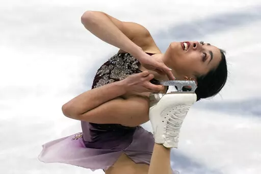 Madeline Schizas, of Canada, performs in the women short program at the Figure Skating World Championships in Montpellier, south of France, Wednesday, March 23, 2022. (AP Photo/Francisco Seco)