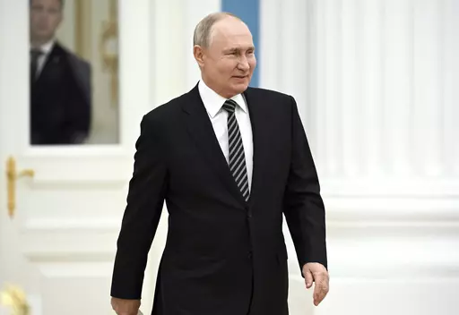 Russian President Vladimir Putin arrives to meet with the leaders of all the main religious denominations of Russia in the Catherine Hall of the Moscow Kremlin in Moscow, Russia, Wednesday, Oct. 25, 2023. (Sergei Guneyev, Sputnik, Kremlin Pool Photo via AP)