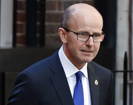 Jeremy Fleming, head of the British Government Communications Headquarters (GCHQ), is photographed in London, Thursday, Feb. 14, 2019. Demoralized Russian soldiers in the Ukraine were refusing to carry out orders, sabotaging their own equipment and had accidentally shot down their own aircraft, Fleming said on Thursday, March 31, 2022. (AP Photo/Frank Augstein, File)