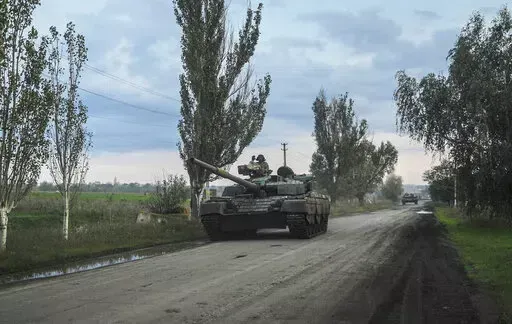 Ukrainian servicemen drive a tank on the way to Siversk, Donetsk region, Ukraine, Saturday, Oct. 1, 2022. (AP Photo/Inna Varenytsia)