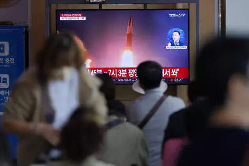 A TV screen showing a news program reporting about North Korea's missile launch with file imagery, is seen at the Seoul Railway Station in Seoul, South Korea, Saturday, Oct. 1, 2022. On Saturday, North Korea fired two short-range ballistic missiles toward its eastern waters, South Korean and Japanese officials said, making it the fourth round of weapons launches this week that are seen as a response to military drills among its rivals. (AP Photo/Lee Jin-man)