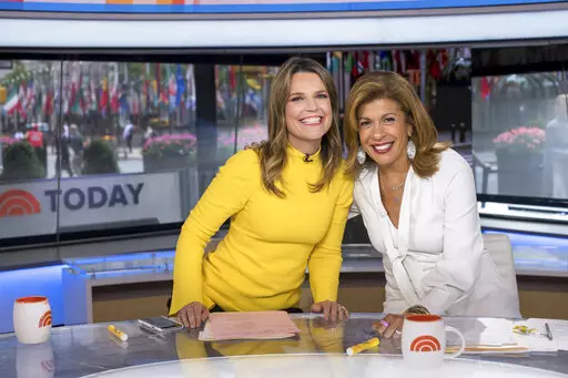 Co-anchors Savannah Guthrie, left, and Hoda Kotb pose on "Today" show set at NBC Studios on June 27, 2018, in New York. On Wednesday NBC addressed the mystery of Kotb's absence on the program. Kotb, who has been absent from the morning show last week and this week, is dealing with an unspecified “family health matter." Guthrie, who left mid-show on Tuesday, tested positive for COVID. (Photo by Charles Sykes/Invision/AP, File)