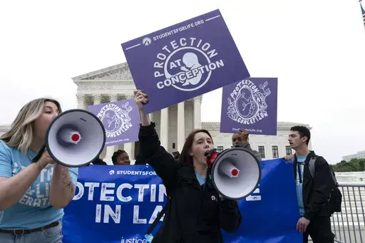 Demonstrators protest outside of the U.S. Supreme Court Tuesday, May 3, 2022 in Washington. A draft opinion suggests the U.S. Supreme Court could be poised to overturn the landmark 1973 Roe v. Wade case that legalized abortion nationwide, according to a Politico report released Monday. Whatever the outcome, the Politico report represents an extremely rare breach of the court's secretive deliberation process, and on a case of surpassing importance. (AP Photo/Jose Luis Magana)