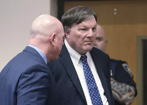 Alleged Gilgo serial Killer Rex Heuermann appears inside Judge Timothy P. Mazzei's courtroom with his attorney Michael Brown at Suffolk County Court in Riverhead, N.Y. on Tuesday, Jan. 16, 2024. Heuermann is indicted in the death of Maureen Brainard-Barnes. (James Carbone/Newsday via AP)