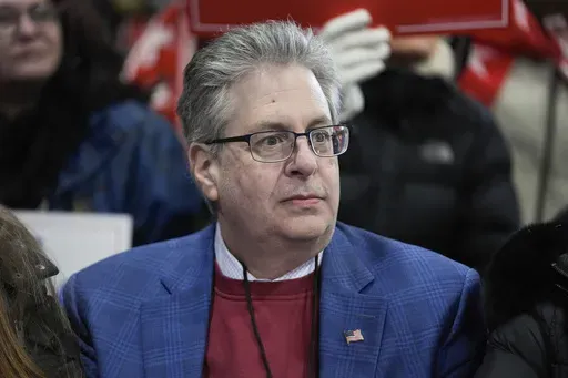 Matthew DePerno listens to Republican presidential candidate, former President Donald Trump, at a campaign rally in Waterford Township, Mich., Feb. 17, 2024. (AP Photo/Paul Sancya, File)
