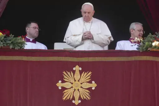 Pope Francis delivers the Urbi et Orbi (Latin for 'to the city and to the world' ) Christmas' day blessing from the main balcony of St. Peter's Basilica at the Vatican, Sunday, Dec. 25, 2022. (AP Photo/Gregorio Borgia)