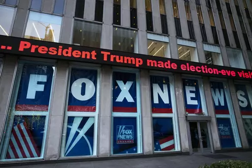 A headline about President Donald Trump is displayed outside Fox News studios in New York on Nov. 28, 2018. Dominion Voting Systems' defamation case against Fox News over its airing of false allegations about the 2020 presidential election will go to trial after a Delaware judge allowed a jury to decide whether the conservative network aired the claims with actual malice, the standard for proving libel. (AP Photo/Mark Lennihan, File)