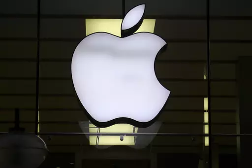The Apple logo is illuminated at a store in the city center of Munich, Germany, Dec. 16, 2020. Apple plans to suspend sales of the Series 9 and Ultra 2 versions of its popular Apple Watch for online U.S. customers beginning Thursday afternoon, Dec. 21, 2023, and in its stores on Sunday, Dec. 24. The move stems from an October decision from the International Trade Commission restricting Apple's watches with a Blood Oxygen feature as part of an intellectual property dispute with medical technology