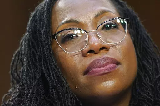 A tear rolls down Supreme Court nominee Ketanji Brown Jackson's cheek as Sen. Cory Booker, D-N.J., speaks during her Senate Judiciary Committee confirmation hearing on Capitol Hill in Washington, Wednesday, March 23, 2022. (AP Photo/Alex Brandon)