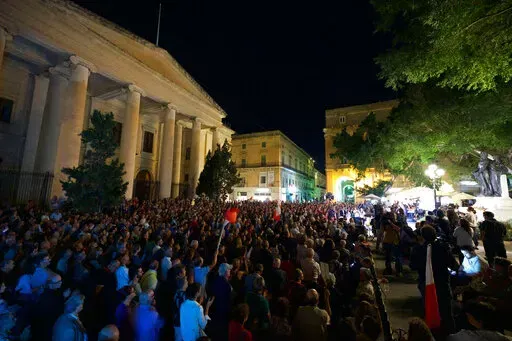 A view outside low court as people attend a gathering to remember Daphne Caruana Galizia, at La Valletta, in Malta. Malta is marking the fifth anniversary of the car bomb slaying of the investigative journalist. It comes just two days after two key suspects reversed course and pleaded guilty to murder of Daphne Caruana Galizia on the first day of their trial. (AP Photo/Rene' Rossignaud)