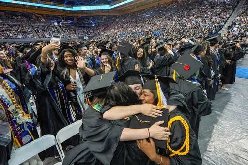 UCLA students celebrate during a commencement ceremony inside Pauley Pavilion on UCLA campus, in Los Angeles, June 14, 2024. (AP Photo/Damian Dovarganes, File)