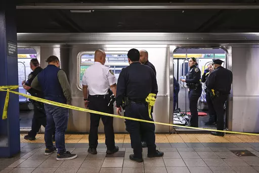 New York police officers respond to the scene where a fight was reported on a subway train, Monday, May 1, 2023, in New York. A man suffering an apparent mental health episode aboard a New York City subway died on Monday after being placed in a headlock by a fellow rider, according to police officials and video of the encounter. Jordan Neely, 30, was shouting and pacing aboard an F train in Manhattan witnesses and police said, when he was taken to the floor by another passenger. (Paul Martinka v