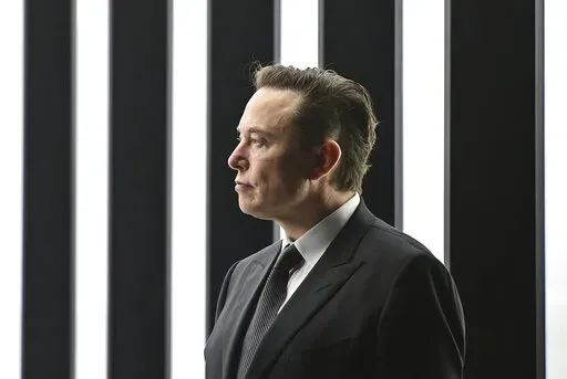 Elon Musk, Tesla CEO, attends the opening of the Tesla factory Berlin Brandenburg in Gruenheide, Germany, March 22, 2022. Elon Musk will be able to include new evidence from a Twitter whistleblower as he fights to get out of his $44 billion deal to buy the social media company, but Musk won’t be able to delay a high-stakes October trial over the dispute, a judge ruled Wednesday, Sept. 7, 2022. (Patrick Pleul/Pool via AP)