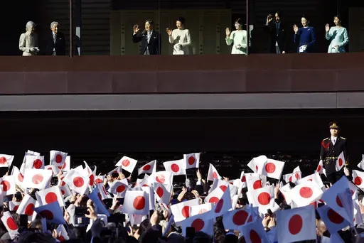 Japan's Empress Emerita Michiko, from left, Emperor Emeritus Akihito, Emperor Naruhito, Empress Masako, Princess Aiko, Crown Prince Akishino, Crown Princess Kiko and Princess Kako wave at well-wishers during a public appearance for New Year celebrations at the Imperial Palace in Tokyo, Thursday, Jan. 2, 2025. (Kim Kyung-Hoon/Pool Photo via AP)
