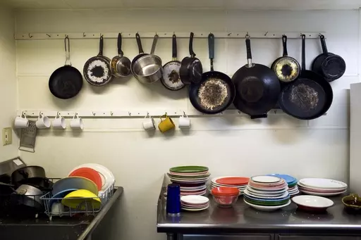 Pots and pans for use at the Venice Hostel are placed near a sink in Venice Beach, Los Angeles, Aug. 14, 2009. Airbnb may have met its match. There’s no shortage of customers who have sworn off the company after being ghosted by owners or hit with unexpected cleaning fees. Airbnb’s operation in New York City is severely restricted, given new regulations implemented in 2023. Meanwhile, hostels — which largely struggled during the pandemic amid concerns about sharing rooms — are back. (AP 