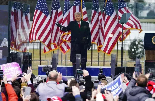 In this Jan. 6, 2021, photo, President Donald Trump arrives to speak at a rally in Washington. A federal judge on Feb. 18, 2022, rejected efforts by the former president to toss out lawsuits filed by lawmakers and two Capitol police officers, saying in his ruling that the former president's words "plausibly" may have led to the Jan. 6, 2021 insurrection. (AP Photo/Jacquelyn Martin, File)