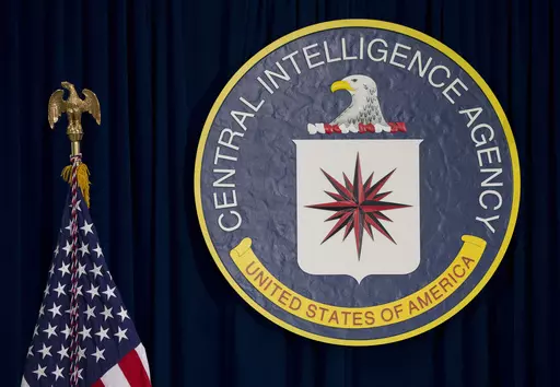 This April 13, 2016 file photo shows the seal of the Central Intelligence Agency at its headquarters in Langley, Va. In February 2024, the CIA terminated a woman whose whistleblower account of being assaulted in a stairwell at the spy agency's headquarters prompted a flood of her colleagues to come forward with their own complaints of sexual misconduct. The woman's attorney called the action a brazen retaliation. (AP Photo/Carolyn Kaster, File)