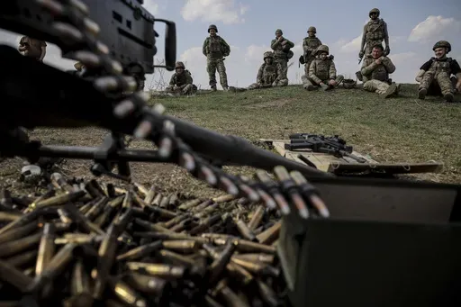 In this provided by Ukraine's 24th Mechanized Brigade press service, servicemen of 3rd mechanized battalion, practice on the training ground at an undisclosed location in the east of Ukraine, Thursday, March 27, 2025. (Oleg Petrasiuk/Ukraine's 24th Mechanized Brigade via AP)