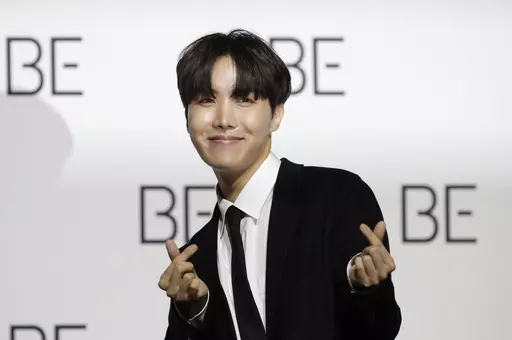A member of South Korean K-pop band BTS J-Hope poses for photographers during a press conference to introduce their new album "BE" in Seoul, South Korea, Nov. 20, 2020. J-Hope entered a South Korean boot camp Tuesday, April 18, 2023 to start his 18-month compulsory military service, becoming the group’s second member to join the country's army. (AP Photo/Lee Jin-man, File)