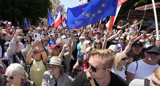 Participants join an anti-government march led by the centrist opposition party leader Donald Tusk, who along with other critics accuses the government of eroding democracy, in Warsaw, Poland, Sunday, June 4, 2023. Poland's largest opposition party led a march Sunday meant to mobilize voters against the right-wing government, which it accuses of eroding democracy and following Hungary and Turkey down the path to autocracy. The march is being held on the 34th anniversary of the first partly free 