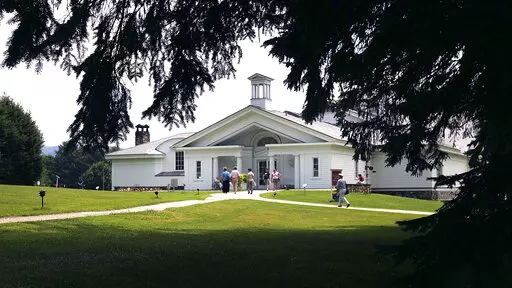 Visitors walk into the Norman Rockwell Museum Friday, July 22, 2005, in Stockbridge, Mass. The museum will present an exhibition, opening on Saturday, May 7, 2022, of works celebrating the 100th anniversary of the Lincoln Memorial. (AP Photo/Chitose Suzuki, File)
