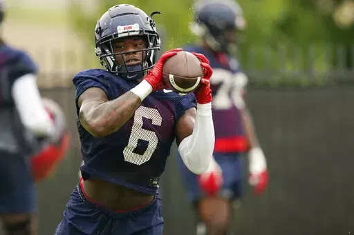 Mississippi running back Zach Evans (6) pulls in a pass during an NCAA college football practice on Aug. 3, 2022, in Oxford, Miss. Evans, a former five-star prospect, ran for 684 yards and five touchdowns in six games last season. (AP Photo/Rogelio V. Solis, File)