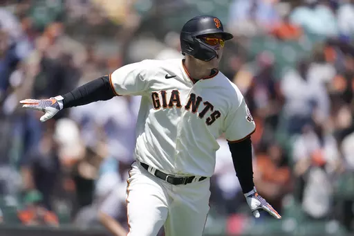 San Francisco Giants' Joc Pederson watches his two-run home run during the first inning of a baseball game against the New York Mets in San Francisco, Wednesday, May 25, 2022. Pederson is scared to fly and shortly after arriving in San Francisco he began working with the club's director of mental health and wellness Shana Alexander and human performance specialist Harvey Martin to cope with his flight anxiety. (AP Photo/Jeff Chiu, File)