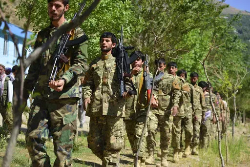 FILE- Militiamen loyal to Ahmad Massoud, son of the late Ahmad Shah Massoud, take part in a training exercise, in Panjshir province, northeastern Afghanistan, on Aug. 29, 2021. Taliban security forces in northern Afghanistan have unlawfully detained and tortured residents accused of association with an opposition armed group, New York-based Human Rights Watch said in a statement Friday, June 10, 2022. (AP Photo/Jalaluddin Sekandar, File)