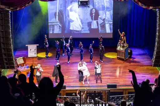 This image shows a live performance of "The Rocky Horror Picture Show" in Atlantic City, N.J., on Oct. 26, 2013. A touring, interactive version of “The Rocky Horror Picture Show” is hitting the road to celebrate the cult film’s birthday with screenings, live shadow casts. (Dennis Parrington via AP)
