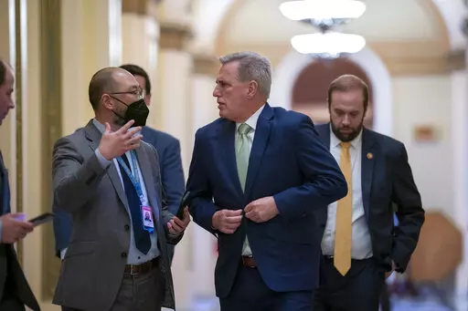 House Minority Leader Kevin McCarthy, R-Calif., talks to reporters as the House voted to hold former President Donald Trump advisers Peter Navarro and Dan Scavino in contempt of Congress over their monthslong refusal to comply with subpoenas from the committee investigating the Jan. 6 attack, at the Capitol in Washington, Wednesday, April 6, 2022. (AP Photo/J. Scott Applewhite)