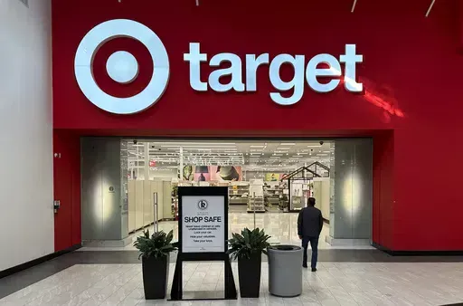 A shopper heads into a Target store Jan. 11, 2024, in Lakewood, Colo. Target plans on cutting prices on thousands of consumer basics this summer, goods ranging from diapers to milk, with more Americans paying closer attention to their spending as inflation cuts into household budgets. (AP Photo/David Zalubowski, File)