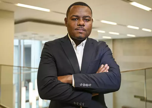 In this photo provided by the Mississippi Department of Archives and History, Michael Morris poses for a picture on the day he was named director of the Museum of Mississippi History and the Mississippi Civil Rights Museum, Monday, July 10, 2023, in Jackson, Miss. The two museums are under one roof in downtown Jackson, and they opened in December 2017. Morris has worked for the MDAH since 2016. (Rodney Thompson/Courtesy of Mississippi Department of Archives and History via AP)