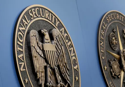 A sign outside the National Security Administration campus in Fort Meade, Md., is seen June 6, 2013. The American public is broadly skeptical of common intelligence practices and of the need to sacrifice civil liberties for security. That's according to a new poll from The Associated Press-NORC Center for Public Affairs Research. (AP Photo/Patrick Semansky, File)