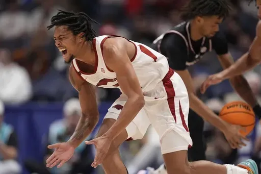 Arkansas guard D.J. Wagner (21) reacts to play against South Carolina during the second half of an NCAA college basketball game at the Southeastern Conference tournament, Wednesday, March 12, 2025, in Nashville, Tenn. (AP Photo/George Walker IV)