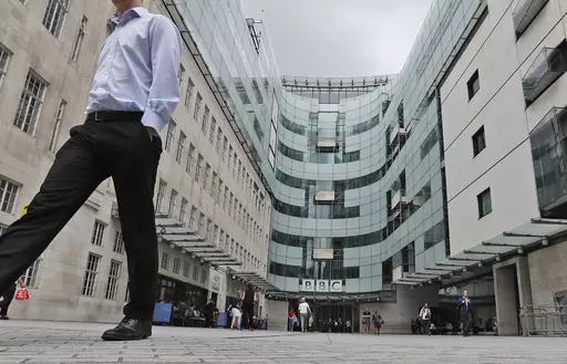 A view of the main entrance to the headquarters of the publicly funded BBC in London, Wednesday, July 19, 2017. Senior British politicians on Sunday, July 9, 2023 called on the BBC to rapidly investigate a complaint that a leading presenter paid a teenager for explicit photos. The publicly funded national broadcaster is under pressure after The Sun newspaper reported allegations that the male presenter gave a youth 35,000 pounds ($45,000) starting in 2020 when the young person was 17. (AP Photo/
