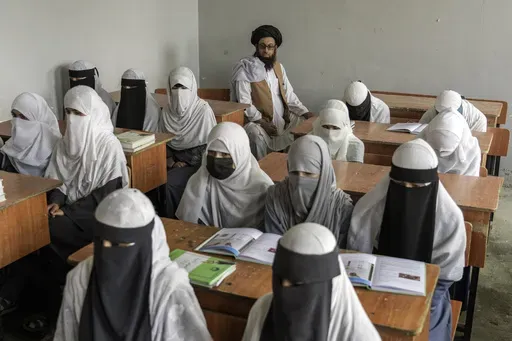 Afghan girls attend a religious school, which remained open since the last year's Taliban takeover, in Kabul, Afghanistan, on Aug. 11, 2022. Afghan girls of all ages are permitted to study in religious schools, which are traditionally boys-only, a Taliban official said Thursday Dec. 21, 2023. (AP Photo/Ebrahim Noroozi, File)