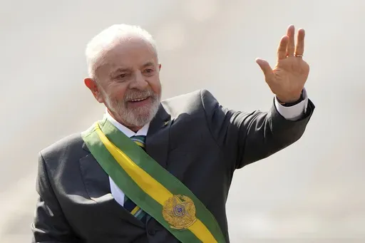 Brazilian President Luiz Inacio Lula da Silva waves at the start of the Independence Day military parade, in Brasilia, Brazil, Sept. 7, 2024. (AP Photo/Eraldo Peres, File)