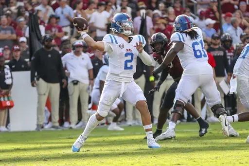 Mississippi quarterback Jaxson Dart (2) throws a pass for a first down during the first half of an NCAA college football game against South Carolina Saturday, Oct. 5, 2024, in Columbia, S.C. (AP Photo/Artie Walker Jr.)