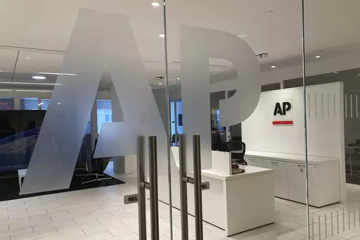 The Associated Press logo is shown at the entrance to the news organization's office in New York on Thursday, July 13, 2023. The Associated Press has issued guidelines for its journalists on use of artificial intelligence, saying the tool cannot be used to create publishable content and images for the news service. (AP Photo/Aaron Jackson, File