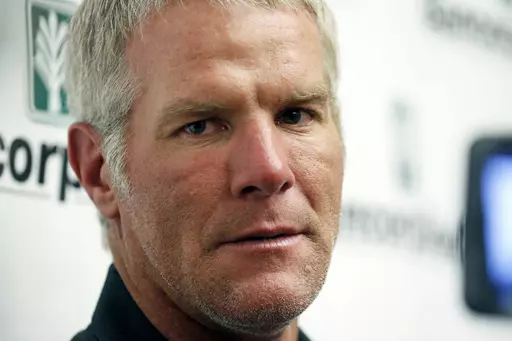 Former NFL quarterback Brett Favre speaks with reporters prior to his induction to the Mississippi Hall of Fame in Jackson, Miss., Aug. 1, 2015. Mississippi Attorney General Lynn Fitch sued Mississippi Auditor Shad White on Thursday, Feb. 22, 2024, saying the auditor is encroaching on the attorney general's power to try to recover misspent welfare money from Favre. (AP Photo/Rogelio V. Solis, File)