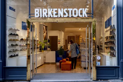 Signange marks the entrance to a Birkenstock store, Oct. 4, 2023, in Frankfurt, Germany. Birkenstock said Tuesday, Oct. 10, that it had priced its IPO at $46 a share, in the middle of its expected price range of $44 to $49 per share. It is due to start trading Wednesday, Oct. 11, on the New York Stock Exchange under the “BIRK” ticker symbol. (AP Photo/Michael Probst, File)