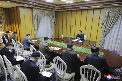 In this photo provided by the North Korean government, North Korean leader Kim Jong Un, top, visits state emergency epidemic prevention headquarters in North Korea Thursday, May 12, 2022. Independent journalists were not given access to cover the event depicted in this image distributed by the North Korean government. The content of this image is as provided and cannot be independently verified.   Korean language watermark on image as provided by source reads: "KCNA" which is the abbreviation fo