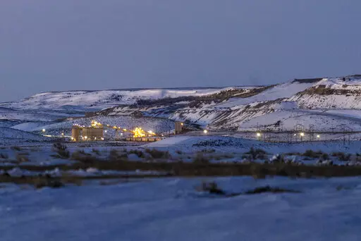 Lights illuminate a coal mine at twilight, Jan. 13, 2022, in Kemmerer, Wyo. With the nearby coal-fired Naughton Powerplant being decommissioned in 2025, the fate of the coal mine and its workers is uncertain. More than 500 days into his presidency, Joe Biden's hope for saving the Earth from the most devastating effects of climate change may not be dead. But it's not far from it after a Supreme Court ruling not only limited the Environmental Protection Agency's ability to regulate pollution by po
