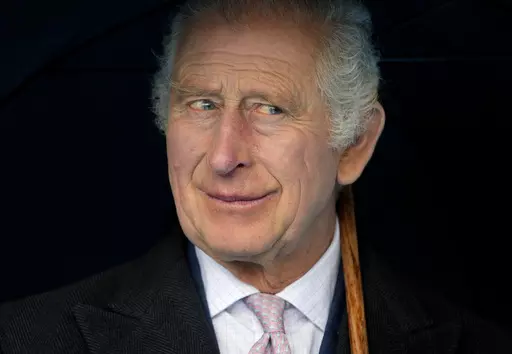Britain's King Charles III smiles during a boat trip, in Hamburg, Germany, Friday, March 31, 2023. King Charles III arrived Wednesday for a three-day official visit to Germany. Britain’s royal family turns the page on a new chapter with the coronation of King Charles III. Charles ascended the throne when his mother, Queen Elizabeth II, died last year. But the coronation Saturday is a religious ceremony that provides a more formal confirmation of his role as head of state and titular head of th